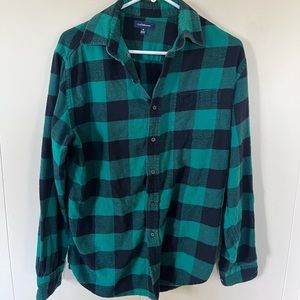 Green flannel button up.